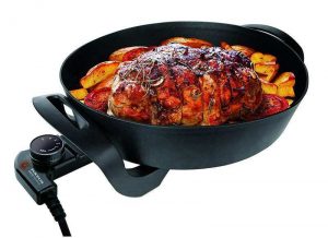 haciendo carne asada con paellera electrica